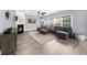 Living room boasts a fireplace, hardwood floors, large windows, and neutral décor at 2321 Norbury Se Cv, Smyrna, GA 30080