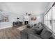 Spacious living room with fireplace, hardwood floors, and lots of natural light at 2321 Norbury Se Cv, Smyrna, GA 30080