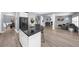 Open-concept living space with a kitchen island, dining area, and comfortable living room at 2321 Norbury Se Cv, Smyrna, GA 30080