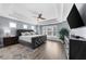 Large main bedroom with trey ceiling, hardwood floors, and a window seat at 2321 Norbury Se Cv, Smyrna, GA 30080