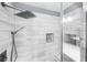 Walk-in shower with white and gray subway tiles, glass door, and modern fixtures creating a spa-like experience at 2321 Norbury Se Cv, Smyrna, GA 30080