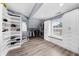 Walk-in closet with lots of shelving, drawers, and a bench seat by the window at 2321 Norbury Se Cv, Smyrna, GA 30080