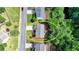 An aerial view shows the location of the home relative to the woods at the rear of the lot at 475 Bayswater Way, Suwanee, GA 30024