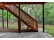 Exterior stairs lead from the upper deck to the backyard at 475 Bayswater Way, Suwanee, GA 30024