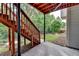 Backyard stairs leading to the upper deck with a green lawn at 475 Bayswater Way, Suwanee, GA 30024