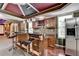 Basement bar featuring granite counters, wine rack, and stainless steel fridge at 475 Bayswater Way, Suwanee, GA 30024