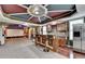 Entertain in this open concept basement featuring a home theater and wet bar at 475 Bayswater Way, Suwanee, GA 30024