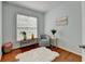 Bedroom featuring a big bright window with a cozy chair and small table to use as a reading nook at 475 Bayswater Way, Suwanee, GA 30024