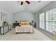 Bright bedroom with ample natural light, neutral colors and vaulted ceiling at 475 Bayswater Way, Suwanee, GA 30024