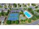 Aerial view showcases the community pool, tennis courts, and basketball court, fostering a sense of recreation and neighborhood spirit at 475 Bayswater Way, Suwanee, GA 30024