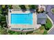 Aerial view of large community pool that has a surrounding seating area, basketball court, and shade for the community at 475 Bayswater Way, Suwanee, GA 30024