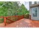 Relax on this wooden deck overlooking a lush, green backyard at 475 Bayswater Way, Suwanee, GA 30024