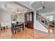 Dining room featuring hardwood floors, tray ceiling, natural light and decorative china cabinet at 475 Bayswater Way, Suwanee, GA 30024