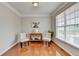 Bright dining room with hardwood floors, natural light, and neutral paint at 475 Bayswater Way, Suwanee, GA 30024
