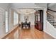 Dining room featuring hardwood floors, tray ceiling, natural light and decorative china cabinet at 475 Bayswater Way, Suwanee, GA 30024