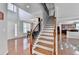 Spacious foyer with hardwood floors and staircase leading to the upper level at 475 Bayswater Way, Suwanee, GA 30024