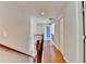 Bright hallway with hardwood floors and access to multiple rooms at 475 Bayswater Way, Suwanee, GA 30024