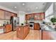 Spacious kitchen with stainless steel appliances, granite countertops, and a functional center island at 475 Bayswater Way, Suwanee, GA 30024