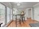 Open-concept kitchen area with a breakfast nook, hardwood floors, and view into the living room at 475 Bayswater Way, Suwanee, GA 30024