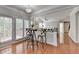 Bright eat-in kitchen area filled with natural light and hardwood floors, open to the living room at 475 Bayswater Way, Suwanee, GA 30024