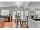 Bright eat-in kitchen featuring stainless steel appliances, granite countertops, and a charming breakfast table at 475 Bayswater Way, Suwanee, GA 30024