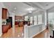 Open kitchen with an island, dark cabinets, and stainless steel appliances at 475 Bayswater Way, Suwanee, GA 30024