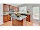Kitchen featuring granite counters, stainless appliances and central island that provides extra work and storage space at 475 Bayswater Way, Suwanee, GA 30024