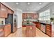Well-equipped kitchen with stainless steel appliances, granite countertops, and ample cabinet space at 475 Bayswater Way, Suwanee, GA 30024