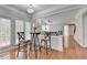 Charming eat-in kitchen area filled with natural light and hardwood floors, open to the living room at 475 Bayswater Way, Suwanee, GA 30024