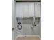 The laundry room has overhead white storage cabinets and tiled floors at 475 Bayswater Way, Suwanee, GA 30024