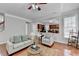 Living room view into an updated kitchen with stainless steel appliances and dark cabinets at 475 Bayswater Way, Suwanee, GA 30024