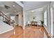 Inviting living room with hardwood floors, neutral paint, and a view into the dining room at 475 Bayswater Way, Suwanee, GA 30024