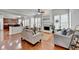Inviting living room features a fireplace, abundant natural light, and hardwood floors at 475 Bayswater Way, Suwanee, GA 30024