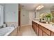 Beautiful ensuite bathroom with a soaking tub, separate shower, and double vanity at 475 Bayswater Way, Suwanee, GA 30024