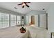 Spacious main bedroom with access to the main bath and ample natural light at 475 Bayswater Way, Suwanee, GA 30024