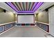 Basement theater room with a projection screen and recessed seating at 475 Bayswater Way, Suwanee, GA 30024