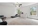 Bedroom with large windows, neutral carpet, ladder for climbing, and closet at 4975 Skyland Pkwy, Cumming, GA 30028
