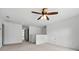 This is a bonus room with carpet and a ceiling fan at 4975 Skyland Pkwy, Cumming, GA 30028