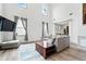 Cozy living room showcases a comfortable gray sofa, wood floors, and plenty of natural light at 4975 Skyland Pkwy, Cumming, GA 30028