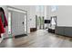 Bright living room featuring soaring ceilings, lots of natural light, and wood flooring at 4975 Skyland Pkwy, Cumming, GA 30028