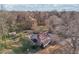 Picturesque aerial view of a charming two-story home featuring a backyard pool and lush greenery at 130 Thornton Dr, Fayetteville, GA 30214