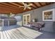 Spacious back deck featuring a fan and grill, perfect for entertaining at 130 Thornton Dr, Fayetteville, GA 30214