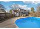 Charming backyard featuring a sparkling pool and outdoor seating area at 130 Thornton Dr, Fayetteville, GA 30214