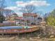 Stunning backyard featuring a spacious wooden deck and an inviting in-ground swimming pool, perfect for relaxation and entertainment at 130 Thornton Dr, Fayetteville, GA 30214