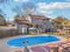 Spacious in-ground pool with plenty of room for entertaining Gathering and friends on the wooden deck at 130 Thornton Dr, Fayetteville, GA 30214
