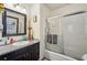 Bathroom features a shower-tub, granite counters, and dark vanity at 130 Thornton Dr, Fayetteville, GA 30214