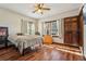 Bedroom featuring a ceiling fan, wood-look flooring, and natural light from the window at 130 Thornton Dr, Fayetteville, GA 30214