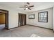Spacious bedroom featuring carpeting, a ceiling fan, and a window at 130 Thornton Dr, Fayetteville, GA 30214