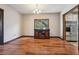 Dining room adjacent to kitchen features hardwood flooring and ample natural light at 130 Thornton Dr, Fayetteville, GA 30214