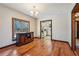 Dining room adjacent to kitchen features hardwood flooring and ample natural light at 130 Thornton Dr, Fayetteville, GA 30214